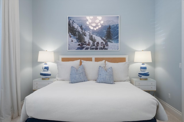 carpeted bedroom with baseboards