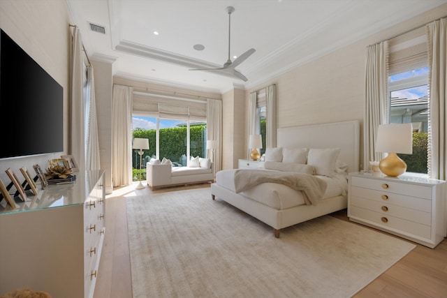 bedroom featuring crown molding, access to outside, light wood finished floors, and visible vents