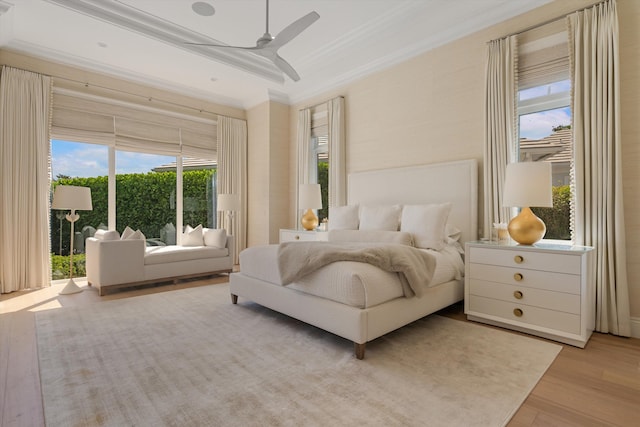 bedroom featuring crown molding, ceiling fan, wood finished floors, and access to outside