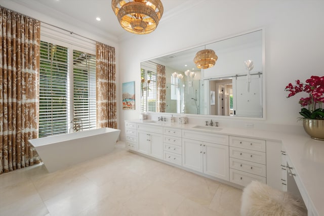 bathroom with double vanity, a shower stall, a sink, and a notable chandelier