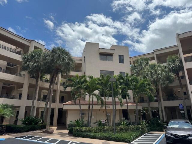 7546 La Paz Blvd Unit 408, Boca Raton, FL 33433 - view of property featuring uncovered parking