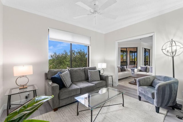 7546 La Paz Blvd Unit 408, Boca Raton, FL 33433 - living room featuring ornamental molding, baseboards, wood finished floors, and a ceiling fan