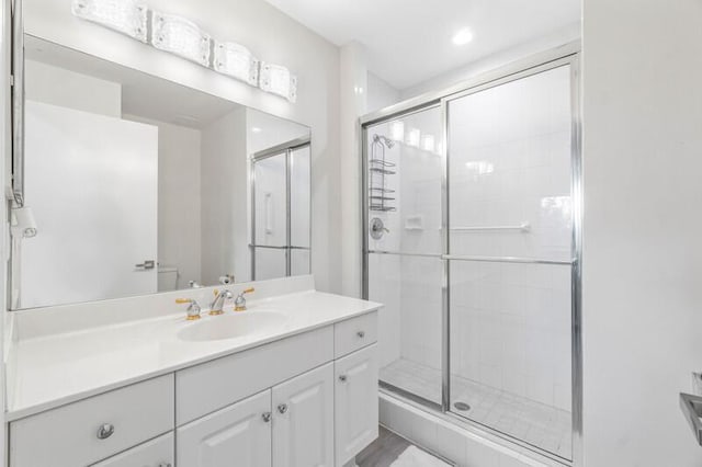 7546 La Paz Blvd Unit 408, Boca Raton, FL 33433 - bathroom with vanity, a shower stall, and toilet