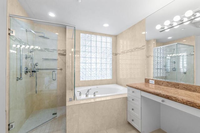 7546 La Paz Blvd Unit 408, Boca Raton, FL 33433 - bathroom with a bath, a stall shower, vanity, tile patterned floors, and recessed lighting
