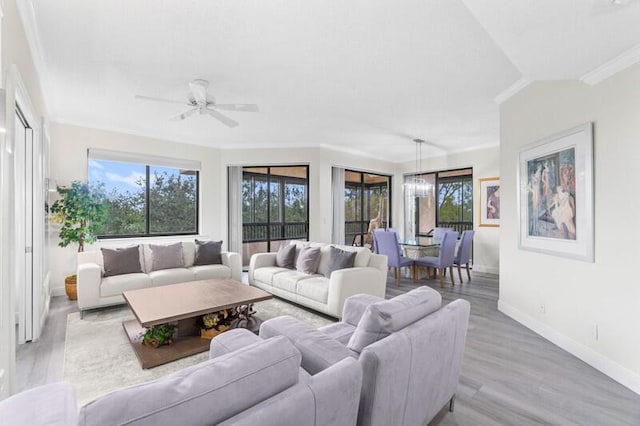 7546 La Paz Blvd Unit 408, Boca Raton, FL 33433 - living room featuring crown molding, baseboards, light wood finished floors, and a ceiling fan