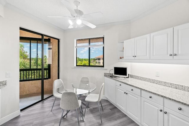 7546 La Paz Blvd Unit 408, Boca Raton, FL 33433 - dining area with light wood-type flooring, a ceiling fan, baseboards, and crown molding