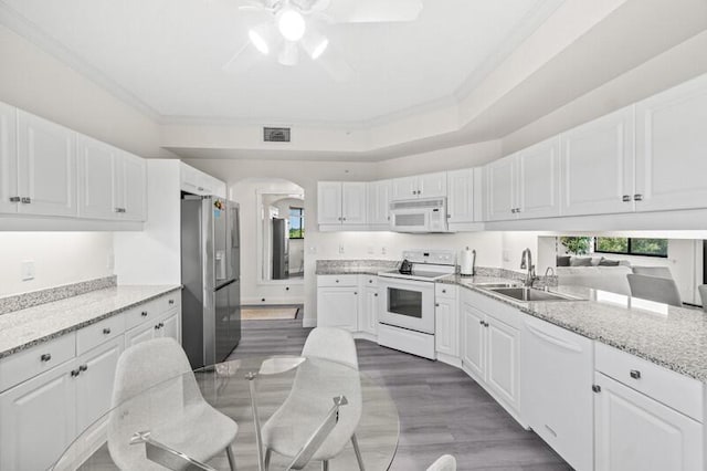 7546 La Paz Blvd Unit 408, Boca Raton, FL 33433 - kitchen with white appliances, a sink, a ceiling fan, white cabinetry, and light wood-style flooring