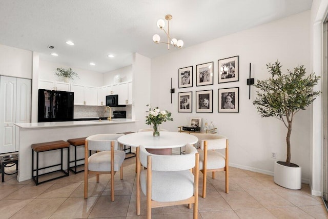 453 Rainbow Springs Ter, Royal Palm Beach, FL 33411 - dining room with recessed lighting, light tile patterned floors, baseboards, and a chandelier