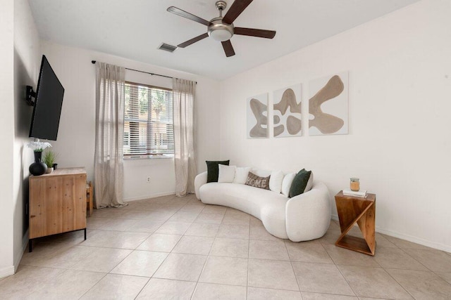 453 Rainbow Springs Ter, Royal Palm Beach, FL 33411 - living area featuring a ceiling fan, baseboards, and light tile patterned floors
