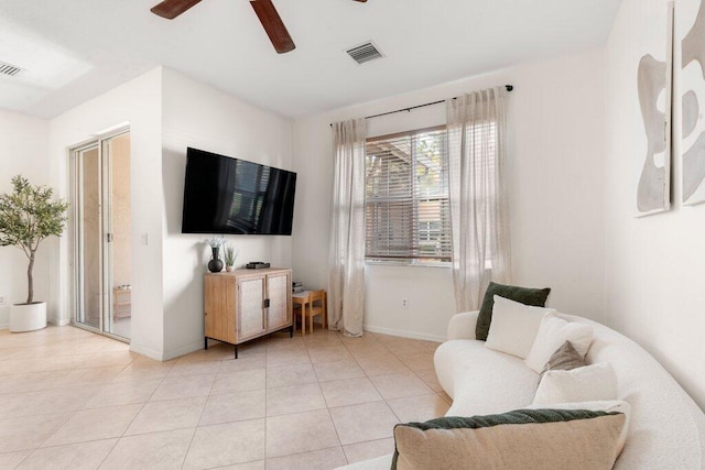 453 Rainbow Springs Ter, Royal Palm Beach, FL 33411 - living area featuring baseboards, a ceiling fan, and light tile patterned floors