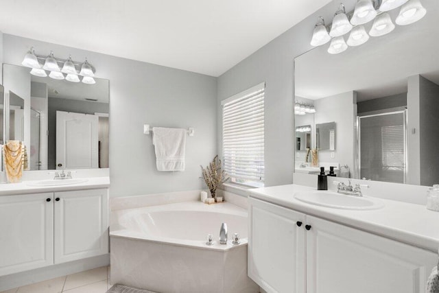 453 Rainbow Springs Ter, Royal Palm Beach, FL 33411 - full bathroom with a stall shower, a garden tub, tile patterned floors, and two vanities