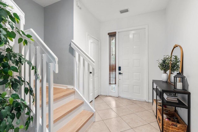 453 Rainbow Springs Ter, Royal Palm Beach, FL 33411 - foyer with stairs, light tile patterned floors, and baseboards