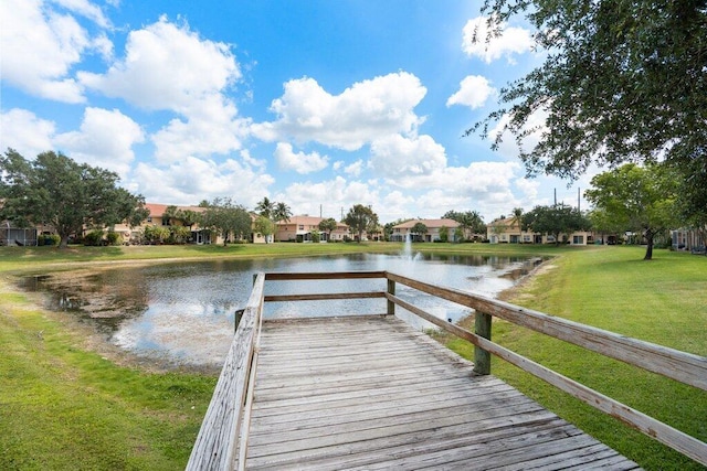 453 Rainbow Springs Ter, Royal Palm Beach, FL 33411 - dock area with a water view, a yard, and a residential view