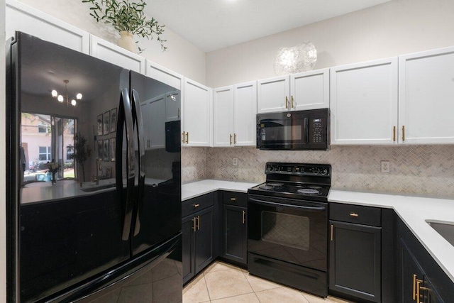 453 Rainbow Springs Ter, Royal Palm Beach, FL 33411 - kitchen with black appliances, light countertops, tasteful backsplash, light tile patterned floors, and white cabinets