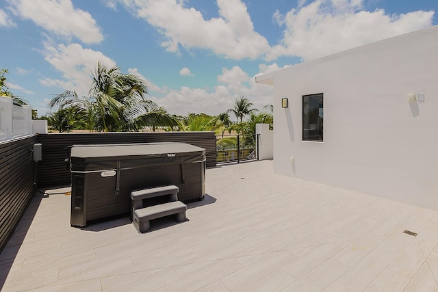 view of patio with a hot tub