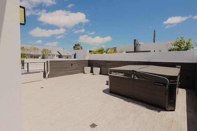 view of patio with a hot tub