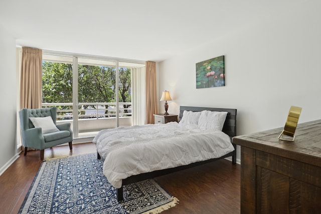 4201 N Ocean Blvd Unit 208, Boca Raton, FL 33431 - bedroom featuring baseboards, dark wood finished floors, and expansive windows
