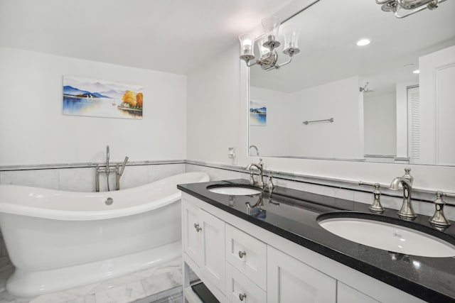 4201 N Ocean Blvd Unit 208, Boca Raton, FL 33431 - bathroom featuring a sink, tile walls, a soaking tub, and double vanity