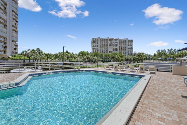 4201 N Ocean Blvd Unit 208, Boca Raton, FL 33431 - community pool with a patio and fence