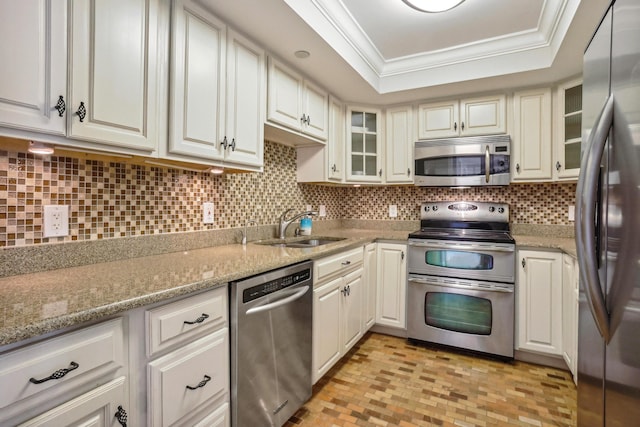 4201 N Ocean Blvd Unit 208, Boca Raton, FL 33431 - kitchen featuring crown molding, a sink, stainless steel appliances, tasteful backsplash, and glass insert cabinets