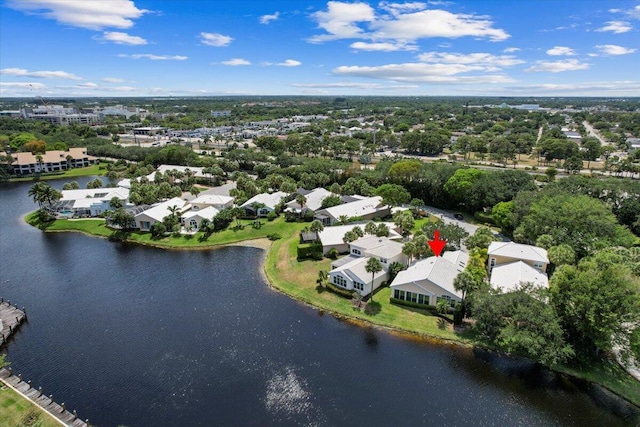 drone / aerial view with a residential view and a water view