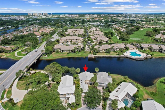 bird's eye view featuring a water view and a residential view