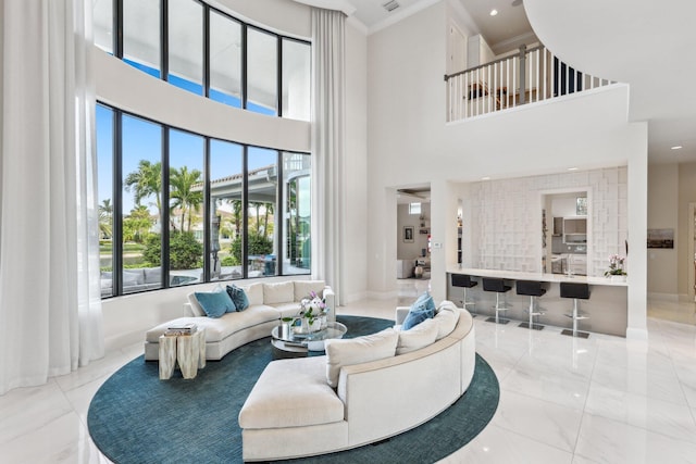 7339 NW 28th Way, Boca Raton, FL 33496 - living area with baseboards, ornamental molding, a towering ceiling, and marble finish floor