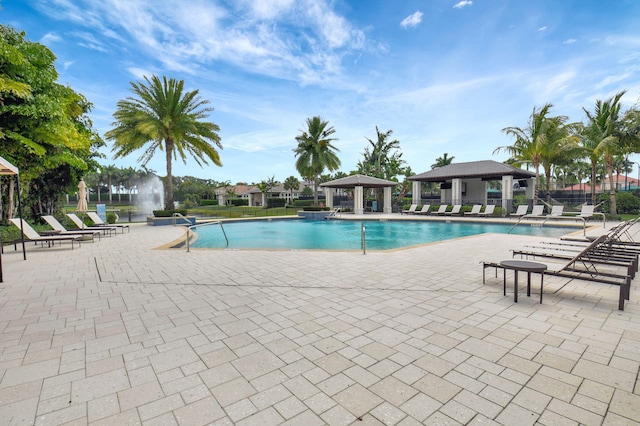 7339 NW 28th Way, Boca Raton, FL 33496 - pool with fence, a gazebo, and a patio area