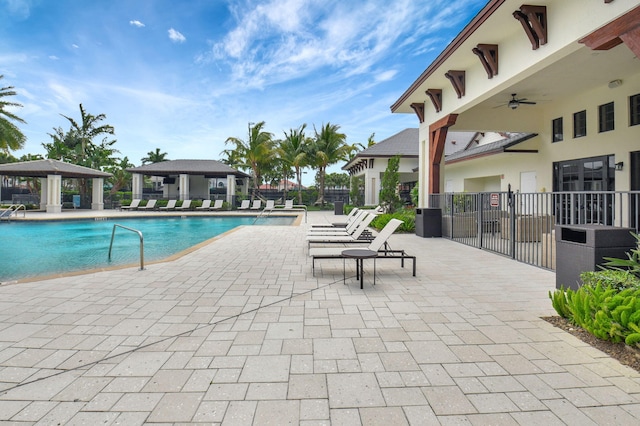 7339 NW 28th Way, Boca Raton, FL 33496 - pool featuring a patio, a gazebo, ceiling fan, fence, and central AC
