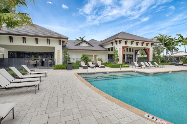 7339 NW 28th Way, Boca Raton, FL 33496 - community pool with fence and a patio area