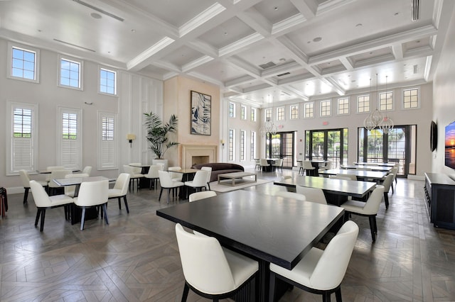 7339 NW 28th Way, Boca Raton, FL 33496 - dining area featuring beam ceiling, coffered ceiling, visible vents, baseboards, and a towering ceiling
