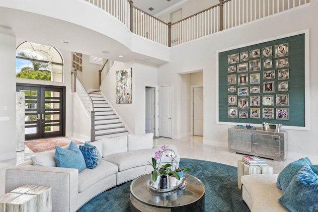7339 NW 28th Way, Boca Raton, FL 33496 - living area with a towering ceiling, french doors, baseboards, and stairs
