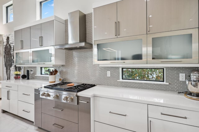 7339 NW 28th Way, Boca Raton, FL 33496 - kitchen with modern cabinets, stainless steel gas stovetop, and wall chimney range hood