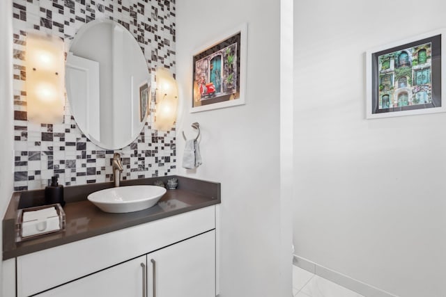 7339 NW 28th Way, Boca Raton, FL 33496 - bathroom with vanity, tasteful backsplash, and baseboards