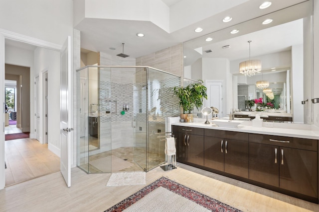 7339 NW 28th Way, Boca Raton, FL 33496 - bathroom with a chandelier, recessed lighting, a shower stall, and vanity