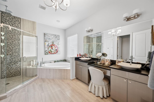 7339 NW 28th Way, Boca Raton, FL 33496 - full bathroom with a chandelier, a sink, visible vents, a stall shower, and a garden tub