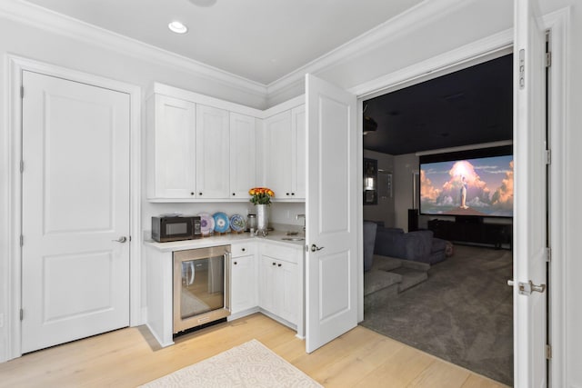 7339 NW 28th Way, Boca Raton, FL 33496 - bar featuring beverage cooler, recessed lighting, light wood-type flooring, black microwave, and crown molding
