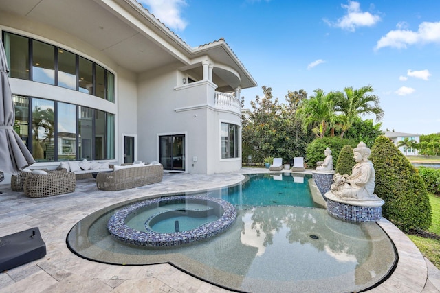 7339 NW 28th Way, Boca Raton, FL 33496 - view of swimming pool featuring an outdoor hangout area, a pool with connected hot tub, and a patio area
