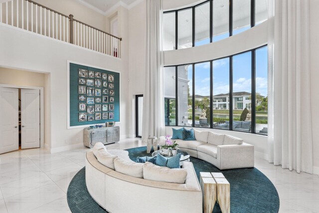 7339 NW 28th Way, Boca Raton, FL 33496 - living room with ornamental molding, a towering ceiling, marble finish floor, and baseboards