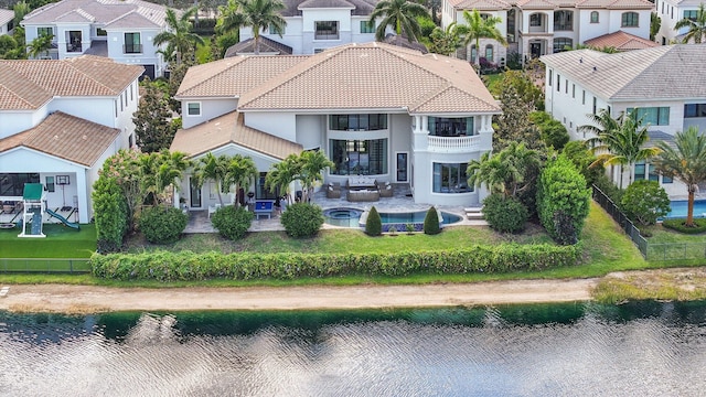 7339 NW 28th Way, Boca Raton, FL 33496 - rear view of property featuring a water view, a balcony, a tiled roof, and a residential view