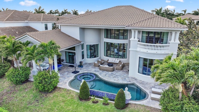 7339 NW 28th Way, Boca Raton, FL 33496 - back of house with stucco siding, a tiled roof, a patio, outdoor lounge area, and a balcony