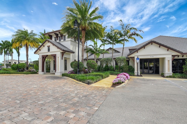 7339 NW 28th Way, Boca Raton, FL 33496 - exterior space featuring stucco siding and uncovered parking