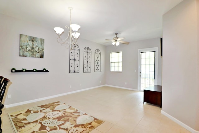 10520 SW Stephanie Way Unit 2204, Port Saint Lucie, FL 34987 - interior space featuring baseboards, light tile patterned floors, and ceiling fan with notable chandelier