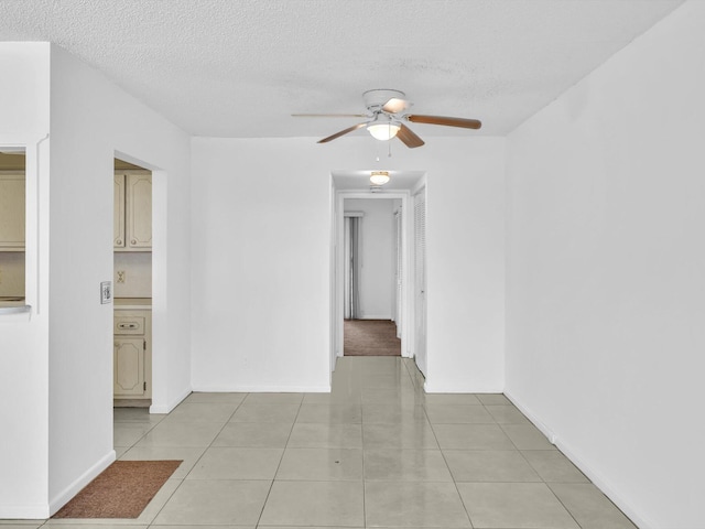 271 Tilford M Unit 271, Deerfield Beach, FL 33442 - spare room with light tile patterned flooring, a ceiling fan, and a textured ceiling