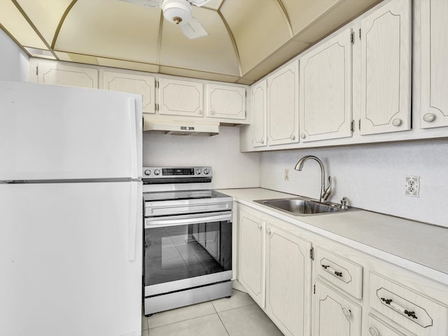 271 Tilford M Unit 271, Deerfield Beach, FL 33442 - kitchen with freestanding refrigerator, under cabinet range hood, light countertops, a sink, and stainless steel range with electric stovetop