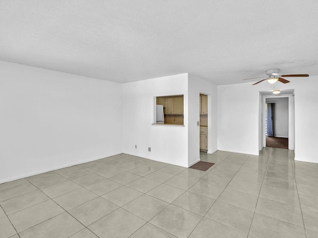271 Tilford M Unit 271, Deerfield Beach, FL 33442 - unfurnished living room with light tile patterned flooring, a textured ceiling, and ceiling fan