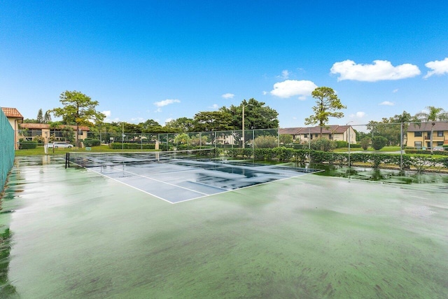 view of sport court with fence