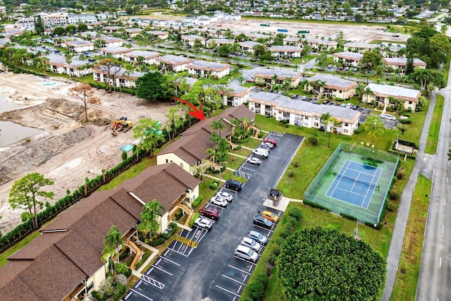 birds eye view of property with a residential view