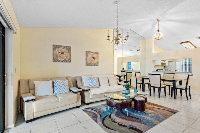living area featuring tile patterned floors, a textured ceiling, a chandelier, and vaulted ceiling