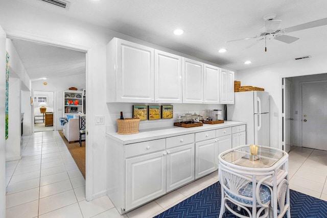 4511 Meadowlark Ln, Boynton Beach, FL 33436 - kitchen featuring freestanding refrigerator, light tile patterned flooring, recessed lighting, ceiling fan, and white cabinetry